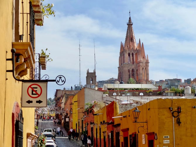 Colorful colonial street with church spire in Tlaquepaque
